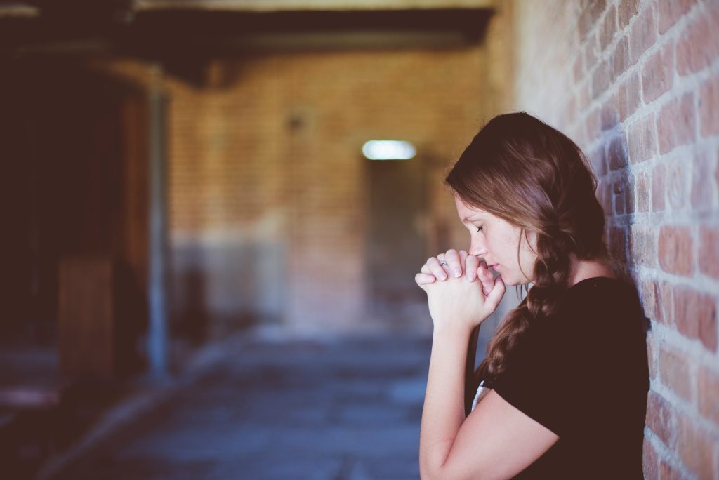 Young woman praying